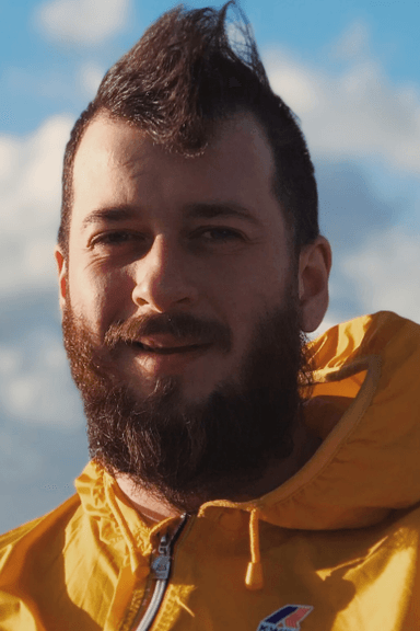 Portrait in yellow jacket, bearded with mohawk