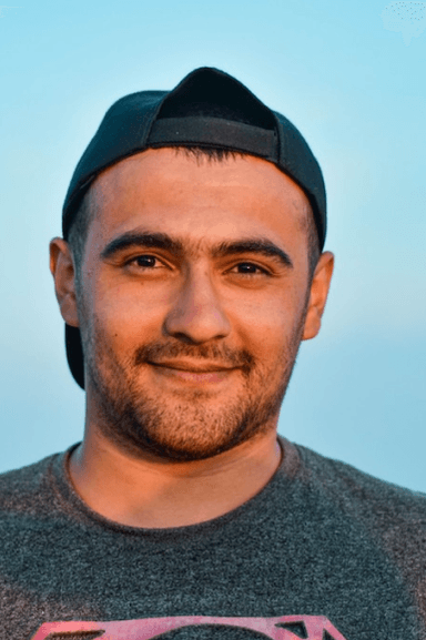 Solo portrait, backward cap, blue sky background